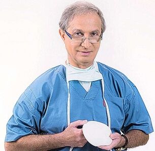 doctor holds implants to enhance breasts