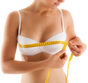 Girl measuring breast volume